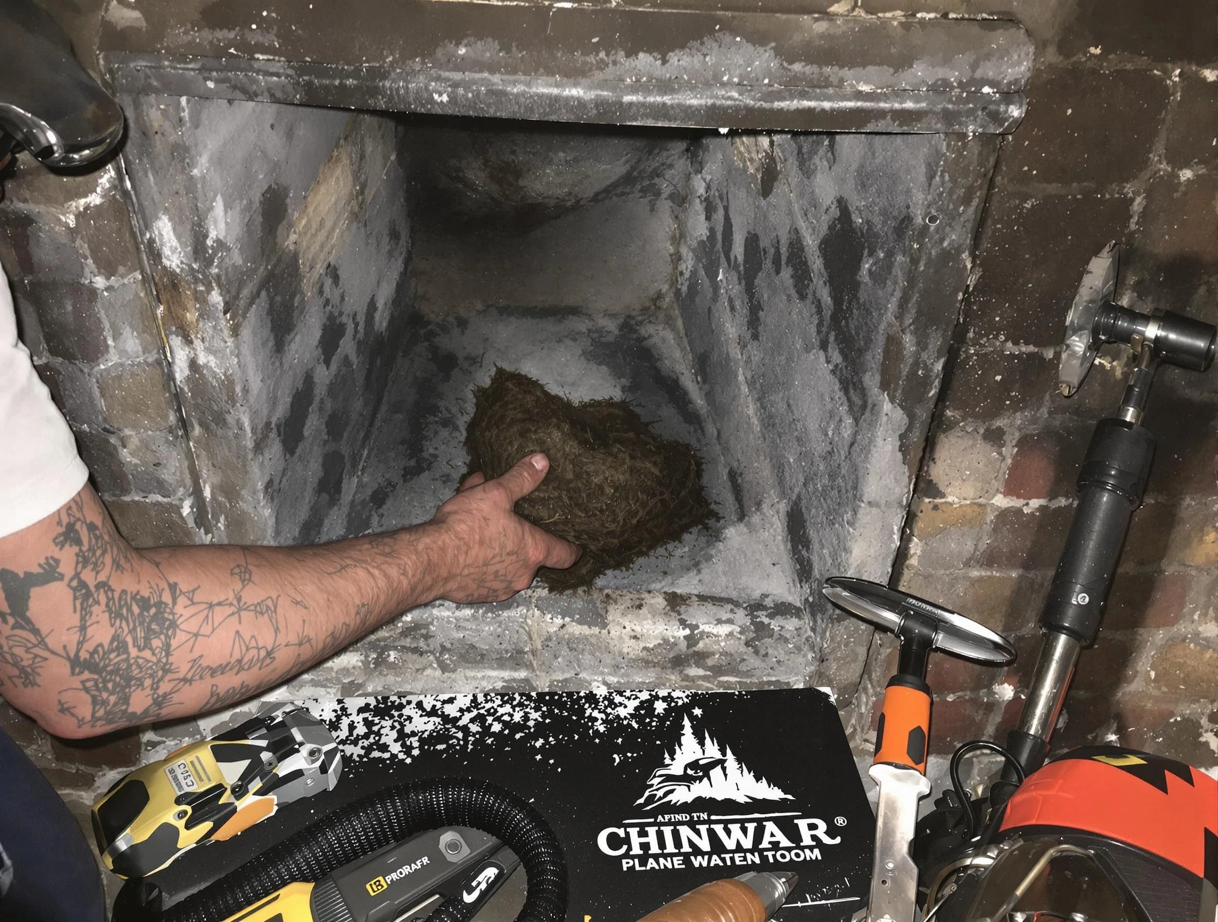 Hackensack Chimney Sweep safely removing debris and screening chimney in Hackensack, NJ